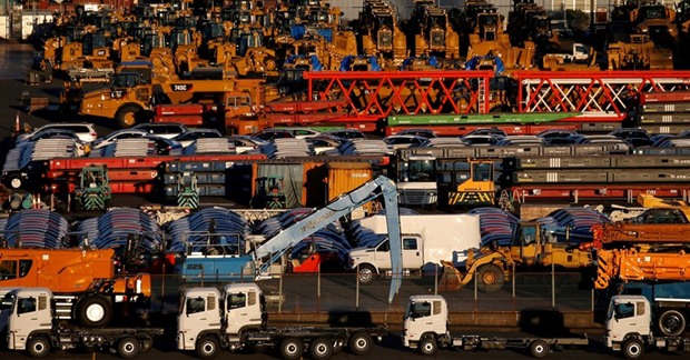 Newly manufactured vehicles await export at a port in Yokohama. Japanu2019s March trade data showed 12% growth in exports, the biggest gain in over two years.