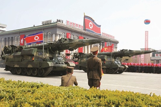 Missiles are driven past the stand with North Korean leader Kim Jong-un and other high ranking officials during a military parade marking the 105th birth anniversary of North Koreau2019s founding father, Kim Il-sung, in Pyongyang on April 15. A senior North Korean defector said in December that as long as Kim is in power, the country would never give up its nuclear weapons, u201ceven if itu2019s offered $1tn or $10tn in rewards.u201d