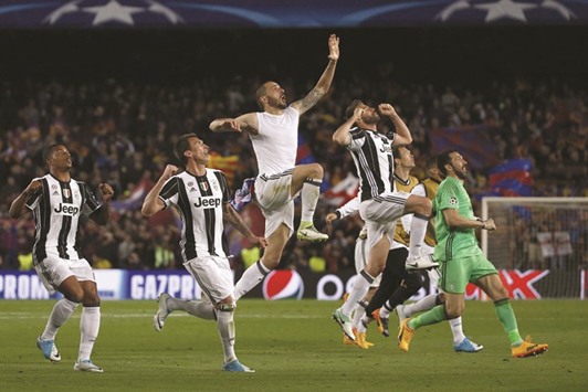 Juventus players celebrate winning  against Barcelona at the Camp Nou stadium in Barcelona on Wednesday.