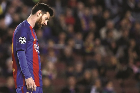 Messi reacts after  Barcelona crashed out yesterday.