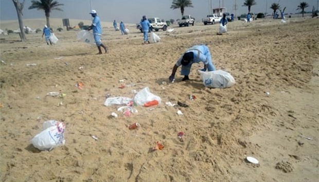 Workers clean Sealine beach.