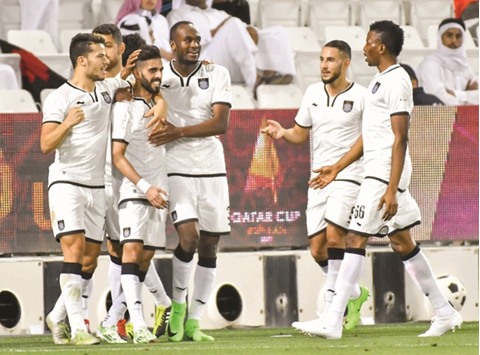 Al Saddu2019s Hassan al-Haydos (second from left) is congratulated by his teammates after he scored against Al Rayyan. PICTURE: Noushad Thekkayil