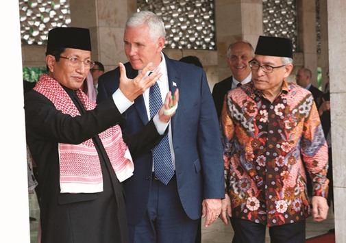 US Vice President Mike Pence is accompanied by high priest Nasaruddin Umar (left) and Istiqlal Mosque management board chairman Mohamed Muzammil Basyuni during his visit to the Istiqlal Mosque in Jakarta yesterday.