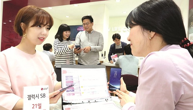 Samsung Galaxy S8 smartphones on display in Seoul. The new smartphone went on sale over the counter in South Korea yesterday as the worldu2019s biggest smartphone maker seeks to move on from a disastrous handset recall and corruption scandal that has hammered its once-stellar reputation.