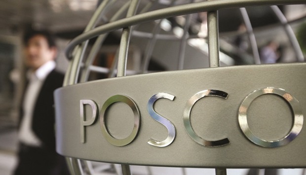 A man walks past the POSCO logo displayed on a steel structure outside the companyu2019s showroom in Seoul. The US is the biggest market after China for South Korean steel products, and accounted for about 12% of the countryu2019s total exports of the metal in 2016, according to South Koreau2019s steel association.