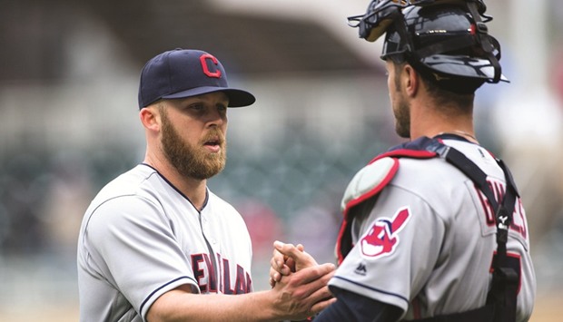 Cleveland Indians relief pitcher Cody Allen (L) celebrates with catcher Yan Gomes after the game inning against Minnesota Twins.
