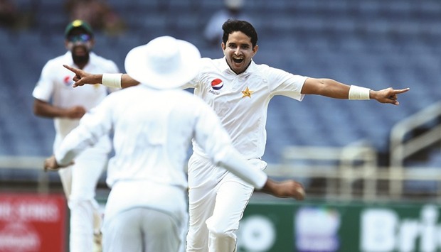 Pakistanu2019s Mohamed Abbas (C) celebrates dismissing West Indiesu2019 Kraigg Brathwaite on Day One of the first Test at the Sabina Park in Kingston, Jamaica, yesterday.