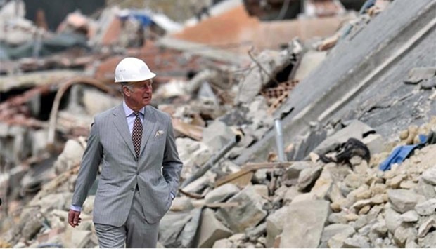 Britain's Prince Charles walks during his visit to Amatrice, which was levelled after an earthquake last year, on Sunday.