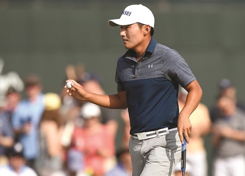 Kang Sung of South Korea gestures after putting on the 18th green during round three of the Houston Open in Humble, Texas, on Saturday. (AFP)