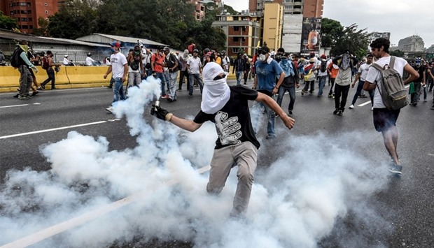 Demonstrators clash with the riot police during a protest against Venezuelan President Nicolas Madur