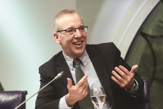 William Dudley, president and CEO of the Federal Reserve Bank of New York, gestures as he speaks during a panel discussion. The median projection for three hikes from the 17 members who comprise the rate-setting Federal Open Market Committee u201cI think is in a reasonable place,u201d Dudley said in a Bloomberg Television interview in Sarasota, Florida.