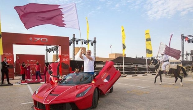 Omar Alfardan, president and CEO of Alfardan Group, with the Qatari flag.