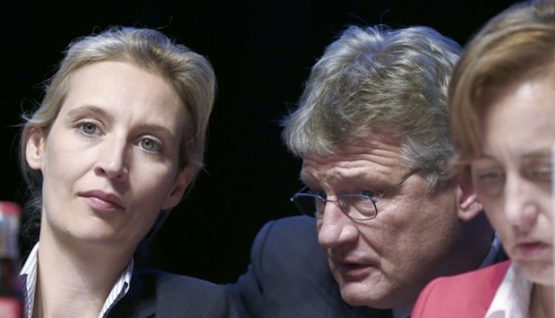 Joerg Meuthen Germany's anti-immigration party Alternative for Germany (AFD) is flanked by Alice Weidel (L) and Beatrix von Storch (R) during the AFD's party congress in Cologne Germany.