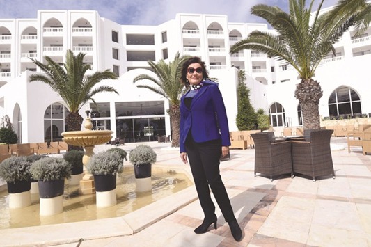 Zohra Driss, owner of the Imperial Marhaba Hotel poses outside the venue in Port El Kantaoui, on the outskirts of Sousse, south of the capital Tunis.