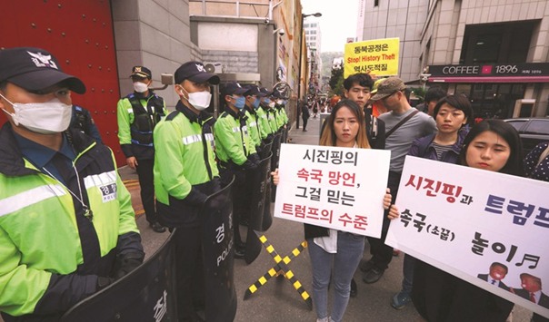 South Korean historians and activists protest outside the Chinese embassy in Seoul on Friday.