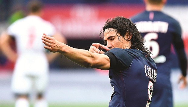 Paris Saint-Germainu2019s Uruguayan forward Edinson Cavani celebrates his goal during the French Ligue 1 match between Paris Saint-Germain and Montpellier at the Parc des Princes stadium in Paris.