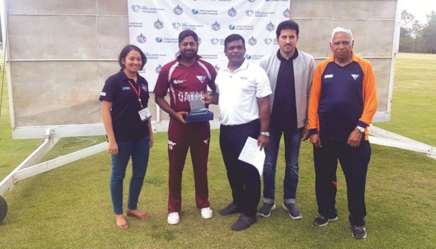 Qatar captain Inam-Ul-Haq with his man of the match trophy.