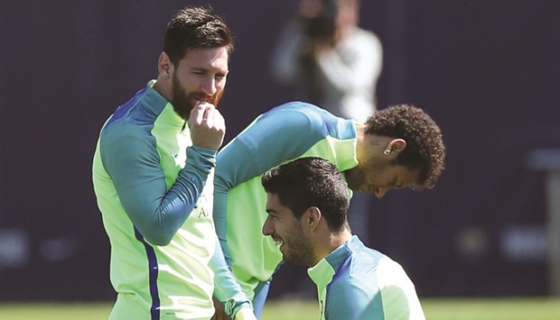 Barcelonau2019s Lionel Messi, Neymar and Luis Suarez take part in a training session yesterday at the Joan Gamper training camp in Barcelona, Spain.
