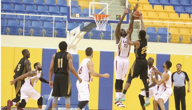 El Jaishu2019s Leon Macklin goes for the basket against Qatar Sports Club. At right, action from the Al Shamal-Al Wakrah match.