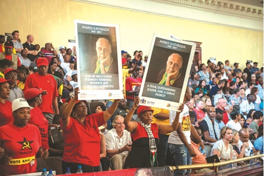South African Comunist Party members and supporters cheer during the late anti-apartheid activist Ahmed Kathradau2019s memorial service at the Johannesburg CIty Hall in Johannesburg late on Saturday.