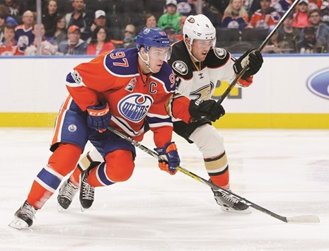 Edmonton Oilers forward Connor McDavid (L) battles with Anaheim Ducks defensemen Cam Fowler (4) during the third period at Rogers Place.