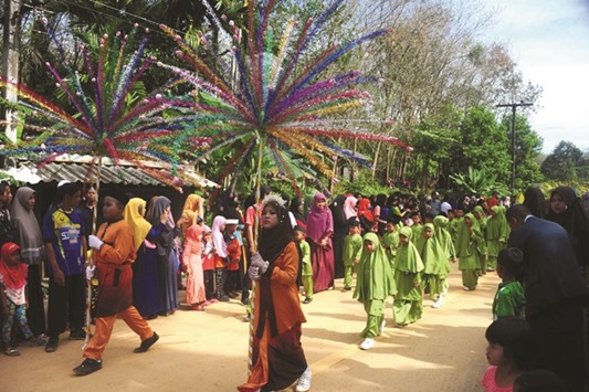 Schoolchildren participate in the opening ceremony of the Tadika Samphan festival, a local celebration for children, in the Chanae district in the southern province of Narathiwat.