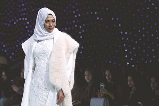 A model presents creations by Malaysian designer Padusi Couture during the 2017 Asia Islamic fashion week in Kuala Lumpur.
