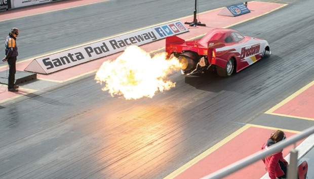 A jet-powered dragster takes part in The Fast Show performance car event held at the Santa Pod Raceway near Wellingborough, central England, yesterday.