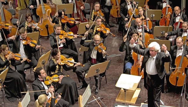 Conductor of Honour, Dmitrij Kitajenko, leads the Qatar Philharmonic Orchestra at Katara Opera House.
