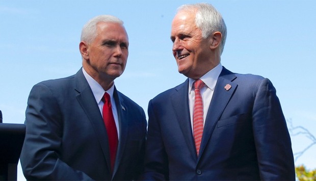 U.S. Vice President Mike Pence (L) shakes hands with Australia's Prime Minister Malcolm Turnbull