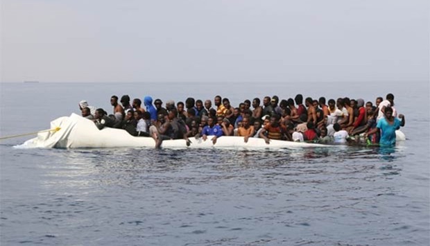 Migrants waiting to be rescued from a sinking dingey off the Libyan coasal town of Zawiyah, as they attempted to cross from the Mediterranean to Europe last month.