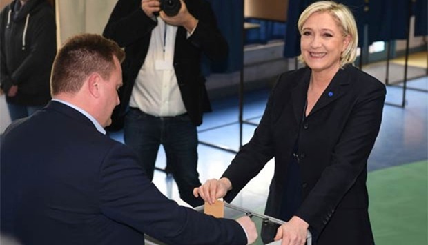 Marine Le Pen casts her ballot at a polling station in Henin-Beaumont, north-western France, on Sunday.