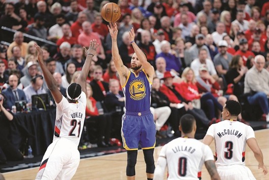 Stephen Curry of the Golden State Warriors shoots the ball over Noah Vonleh of the Portland Trail Blazers during game three of the Western Conference quarter-finals of the 2017 NBA Playoffs in Portland. (Getty Images/AFP)