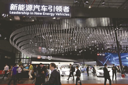 People visiting the New Energy Vehicles area during the first day of the 17th Shanghai International Automobile Industry Exhibition. Chinau2019s electric-car market is already the worldu2019s biggest, but a government proposal to require automakers to produce a certain percentage of u2018new-energyu2019 vehicles in the country is further charging it up.