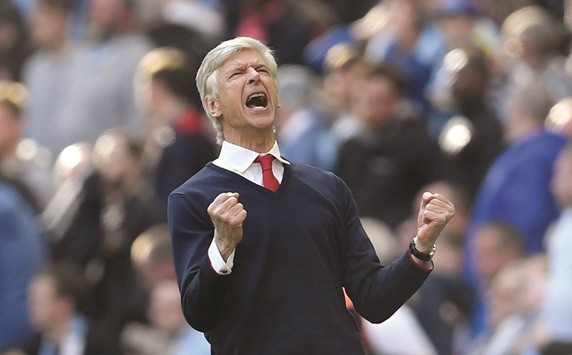 Arsenal manager Arsene Wenger celebrates after the match.