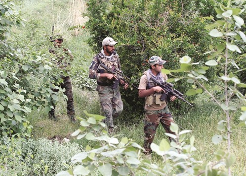 Afghan Special Forces patrol at the site of a MOAB, or u2018u2019mother of all bombsu2019u2019, which struck the Achin district of the eastern province of Nangarhar, Afghanistan, yesterday.