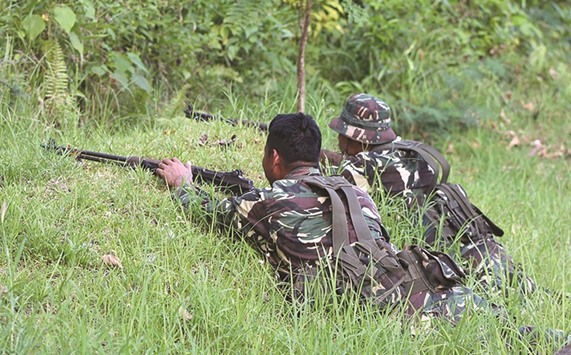 Soldiers taking position after a clash with gunmen in the town of Clarin, Bohol province.