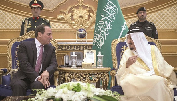 A handout picture provided by the Saudi Royal Palace yesterday shows Saudi Arabiau2019s King Salman meeting with Egyptian President Abdel Fattah al-Sisi in the capital Riyadh.