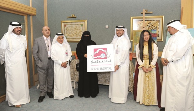 Al Ahli Hospital and Qatar Society for Rehabilitation of Special Needs officials at the event.