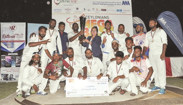Winners of the cricket tournament celebrate their victory.