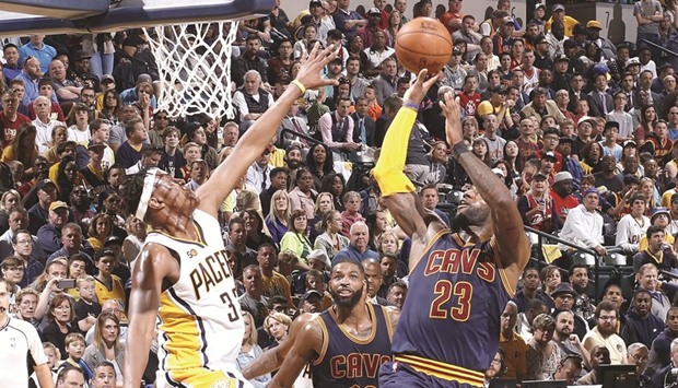 LeBron James (right) of the Cleveland Cavaliers drives for a basket in Game Four of the Eastern Conference quarter-finals during the 2017 NBA Playoffs against the Indiana Pacers in Indianapolis, Indiana, on Sunday. (AFP)