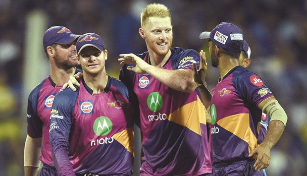 Rising Pune Supergiants Ben Stokes (C) celebrates with teammates after the dismissal of Mumbai Indians Jos Buttler during their IPL match. (AFP)