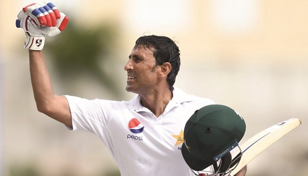 Pakistanu2019s Younis Khan celebrates after reaching his 10,000th run in Test matches on day three of the first Test against West Indies. (AFP)