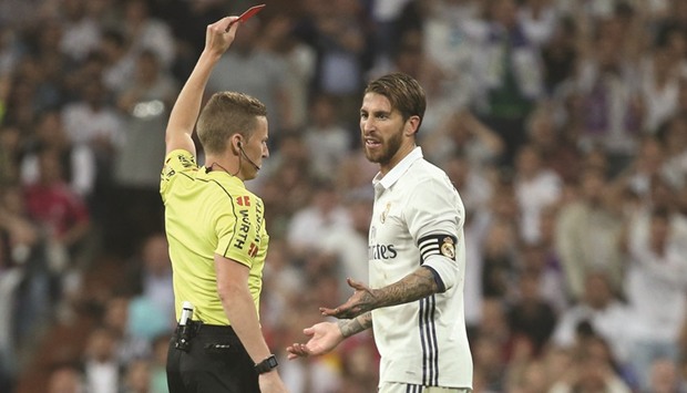 Real Madridu2019s Sergio Ramos is shown a red card.
