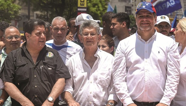 Venezuelan opposition deputy Henry Ramos Allup (centre) marches against President Nicolas Maduro in Caracas yesterday.