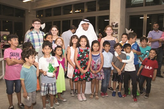Al-Hajri with some of the participants of the Shams Generation 3 exhibition.