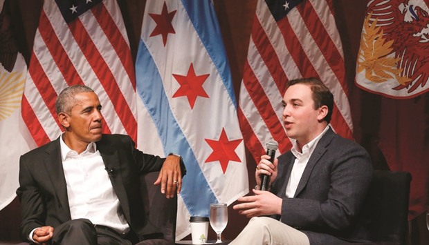 Barack Obama listens to Max Freedman during a forum with young leaders.
