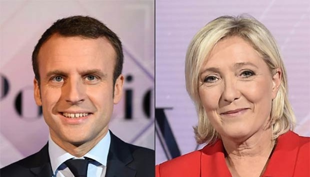 (File photo) French leader Emmanuel Macron and far-right rival Marine Le Pen.