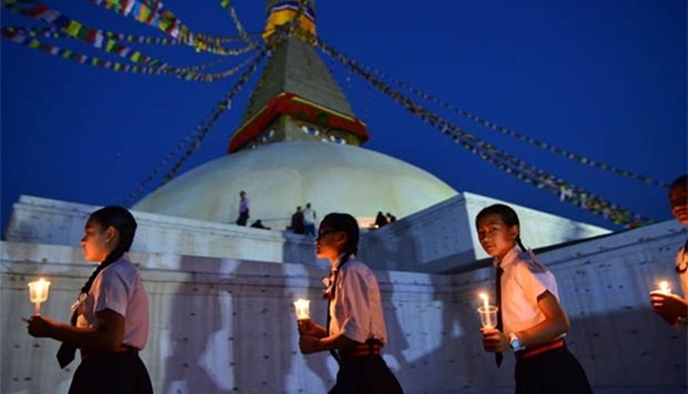 Nepalese school children take part in a candle lighting memorial for the victims of the April 25, 2015 earthquake in Kathmandu on Tuesday.