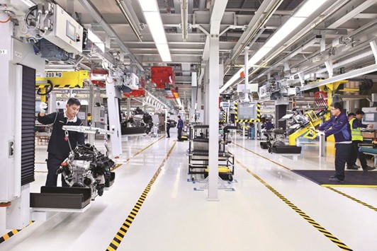 BMW Brilliance Automotiveu2019s engine plant in Shenyang, Northeastern China. The companyu2019s shares rose yesterday on speculation some automakers in China may choose to sell their stakes in the joint ventures to their foreign partners once the foreign investment cap is eased.